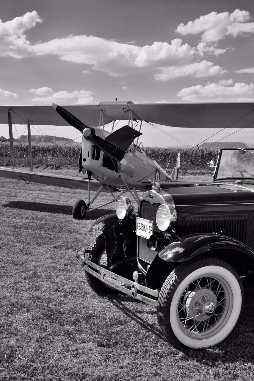 A scene from the 1930’s, a Model A convertible and a Tiger Moth Picture by Lynette McCrystal
